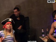These young crew is having fun at the Halloween party. Girls are looking hot and sexy wearing various costumes. The company is playing game with the bottle so those to whom the bottle points on french kiss.