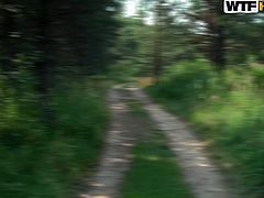 Frisky Russian brunette teen in steamy blue bikini heads deep into the forest with her aroused BF in order to find a perfect place for hard fuck.