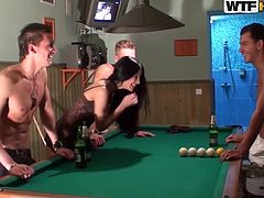 Hot tempered Russian brunette in steamy camisole plays pool surroused by three rapacious dudes. After they drink a significant amount of alcohol, they start taking off her clothes leaving her naked before fucking hard in steamy group sex session by WTF Pass.