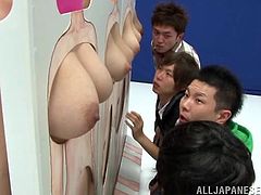 Four beautiful Japanese girls are having fun at a show. They demonstrate their tits and pussies and then kean forward to get their pussies fucked from behind.