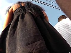 Brunette gets filmed in public and has her panties revealed by voyeur's cam