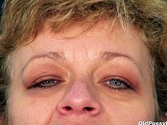 Overaged slutty bitch shows off all the inserts of her gross pinkish pussy while sitting int he gynecological chair before she widens it with speculum in steamy sex clip by Naughty Head Nurse.
