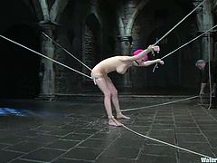 Kinky girl gets tied up and then gagged with a spider gag. After that the guy puts plastic bag over her head and throws the girl into the water.