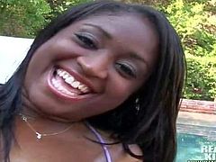 Attractive black babe with natural tits in provocative bikini enjoys teasing her neighbor with gigantic oiled ass in his backyard by the pool while he films her in point of view