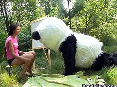 Naughty teen gets dirty with kinky panda bear. He flirts with her, she gets naked and ends up sucking his huge rubber cock.