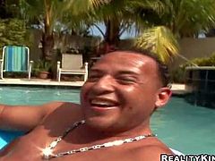 Candy is a super sexy wet ebony babe with amazing round ass. She exposes her bubble butt in the middle of the pool and gets her pussy fingered from behind by white curious guy in the sun.