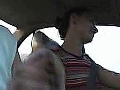 Girl stroking cock in a car