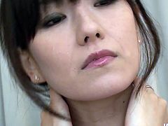 Manami Komukai is a dainty pale skin Japanese beauty. She takes off her silk robe and gets her delicious hairy cunt fondled with two massive vibrators.
