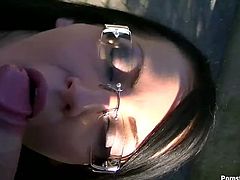 Four eyed brunette seductress is so impressed by the size of her lover's cock that she starts sucking it right in public.