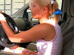 Pretty and playful blonde cutie was driving her car when suddenly she felt desire to masturbate. So, she sits on backseat, raises skirt and starts playing with snatch.