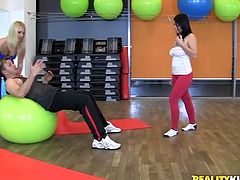 Slutty curvy and lissom gals are in the gym. Kinky brunette and blondie seduce their coach for threesome. While lucky bastard eats the wet juicy pussy of buxom brunette, horny blondie gives his strong dick a solid blowjob for sperm.