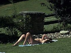 Sex hungry brunette milf with curvy frame stands in doggy pose outdoors fingering her soaking vagina before she lies on her back to keep finger fucking it.