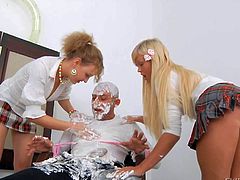 Omar Galanti gets his hard rod covered with whipped cream and then licked and sucked by two nasty blonde hotties, Anita Hengher and Bella D on their knees