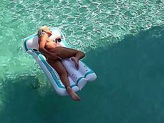 Turned on young blonde babe Evelyn with natural boobies and tight ass get naked and fingers her tight honey pot to orgasm while teasing in backyard in the pool.