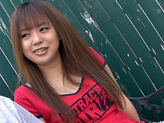 Fresh faced Japanese amateur hooks up with a horny dude in the street. They kiss in lips with passion before she unzips his fly to reach a sturdy penis for a blowjob.