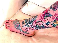 Hollie Hatton takes off her clothes and lays naked on the bed and shows all of her tattoos on cam
