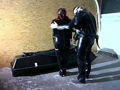 See a redhead slave clad in latex getting ready for some wild bdsm games with her master in the dungeon.
