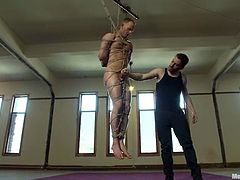 There are few words to describe this dude's pain. He gets gagged with a tiny iron bar and then suspended in the tightest bondage!