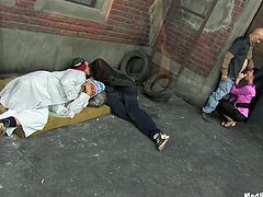These chicks are so horny that it is really scary! When they get joined by some homeless men it doesn't take long before they are sucking off their cocks.