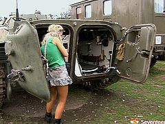 Kinky blonde soldier with hell seductive appeal is going dirty in Seventeen Video clip. She poses on cam having military truck on a background.