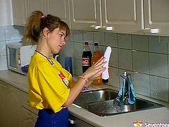 This gal in loose yellow T-shirt gets tired of washing the dishes. Palatable cutie with sweet tits and nice rounded butt spreads legs on the kitchen counter and starts polishing her wet pussy with a pink dildo right away.