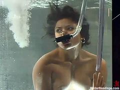 Hot brunette Maya is having fun with a lewd mistress indoors. The dominatrix drowns Maya and then stimulates her wet pussy with a dildo.