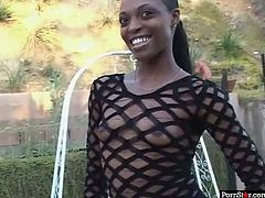 Slender Ebony hottie in classy stripped dress poses seductively in front of sex hungry dude before she kneels down in front of him to mouth fuck his hard tool.