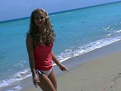 Playful curly blond chic takes a walk at the beach in steamy bikini. Later she shows off her big firm tits that will definitely drive you crazy in sultry sex video by Pornstar.