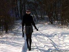 She is lusty brunette hooker with skinny body. She walks in the forest in winter time. She slips down her pantyhose and starts pissing on a snow. Then she reveals her man's cock out of his pants. He gives him hot blowjob outdoor.