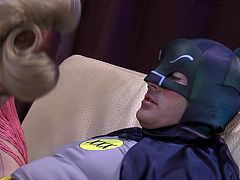 Batman and Robin are trying to apprehend the Riddler. His underground lair is below a go go club and Batman arrives and does the Batusi. One of Riddler's sexy henchwomen is turned on by Batman's dance and she sucks on his batpole.