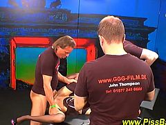 See a vicious German brunette in black stockings getting banged by 3 dudes before they give a great golden shower.