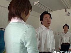 Sex hungry Japanese teacher has wild threesome sex with two her students. She sucks their dicks passionately and then gets pounded on on the floor right in a classroom.