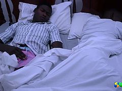 Check out these horny african studs cuddling on the kingsize bed. They start taking off their clothes and jerk of each other's uncut cocks!