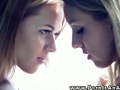 Two hot lesbian babes are in a sensual session as they kiss, kiss, finger, and lick their pussies. One babe gets on the floor to lick on the other and they use some of their toys.