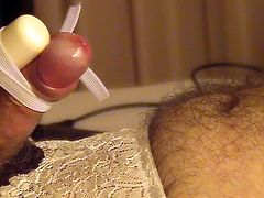 Close up of CD Cumming Hands Free with Vibrator