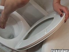 This blonde makes the bathroom all dirty and her boyfriend is upset. He makes her lick the toilet seat clean and she dips her toes into the toilet water. Then, she gets to work on sucking her man's cock. Look at her go.