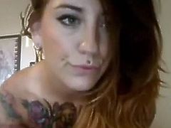 Breathtaking brunette with tatts and big tits rubs her cunt