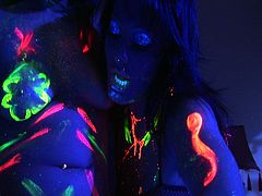 The amazing pornstars Alexis Love, Sandra Romain and Michelle Avanti have their bodies painted with phosphorescent paint and they use phosphorescent toys to fuck all their holes.