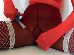 Slutty doll enjoys pure fetish by masturbating her vag through the pantyhose