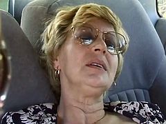 Mature blonde lift her dress up and stars to masturbate right in the car. After that she gets her hairy pussy fucked rough by a younger dude.