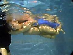 Slim blonde girl gets tied up to a column by the pool. Then she gets her pussy toyed with a vibrator by her master. She also gets humiliated in the pool.