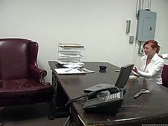 Naughty red haired secretary is about to give her boss steamy blowjob. She unbuttons her blouse and he starts to play with he juicy tits.