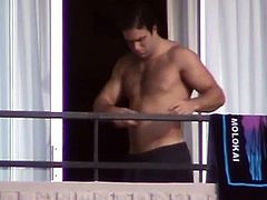 half naked and naked guys on the balcony