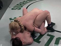 Brunette and blonde chicks wrestle in Ultimate Surrender competition. Tawni Ryden loses in the result of a tight fight. So, she licks Devi's pussy and gets toyed rough.