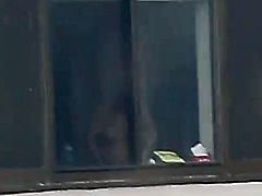 window voyeur - busty girl changing clothes