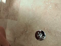 Cute blonde teen is foaming her slender body in the shower