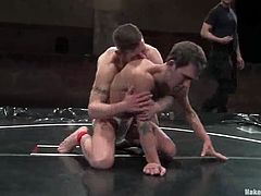 Dean Tucker and James Hamilton are having a scuffle on tatami. They struggle with each other in grey mud and then the loser favours the winner with a blowjob and welcomes his prick in his butt.