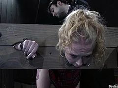 Blonde chick in the stocks gets her ass spanked and stuffed with a hook. After that she gets her pussy drilled painfully with big dildo.