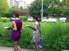 Appealing women with stunning bodies are looking sextractive wearing fancy dresses. They are having lunch on a loan outdoor. They both get a bit messy with ketchup.