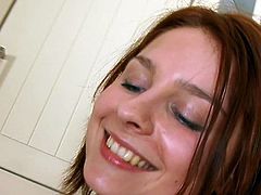 Young redhead masturbating in the kitchen